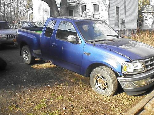 1997 ford f 150 supercab blue / TIRES too