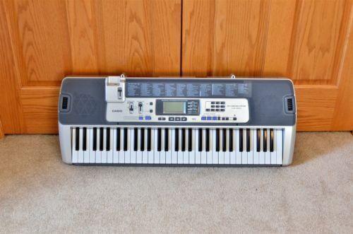 Casio LK-100 61-Key Electronic Piano Musical Keyboard - Lighted Keys