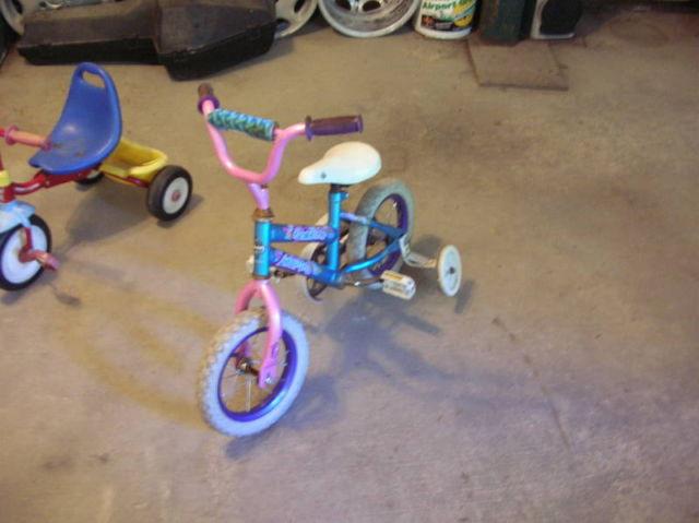 Child's bicycle and two tricycles