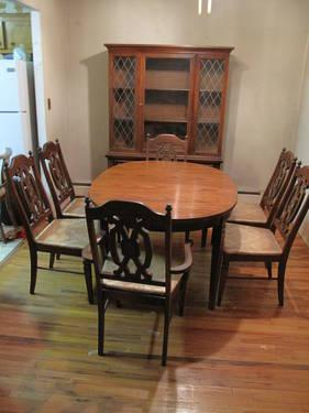 dinning room set table, 6 chairs (2 arm 4 reg.) and a china cabinet