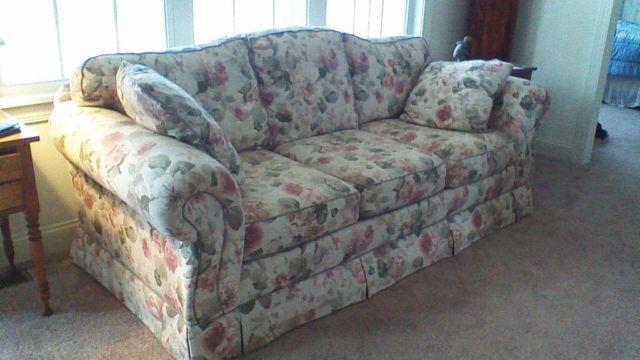 Floral-patterned couch and loveseat