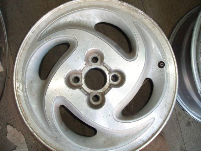 Hollander 7004 SATURN alloy wheel 15x6 4 lug 1992 -1996 used