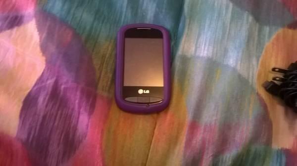 lg android touch phone with purple case