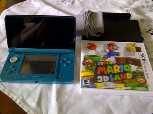 Red Nintendo 3ds with 6 games