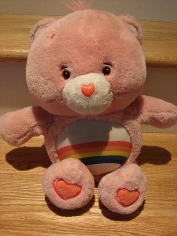 Talking Care Bear; pink fur; rainbow belly (2002) talks/lights up; VGC
