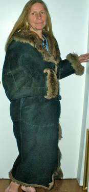 THIS IS A LADIES BLACK PERSIAN LAMB AND LEATHER COAT.