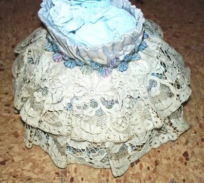 Unusual hand made pin cushion made by a seamstress with a lace exter