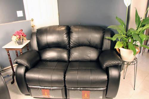 Used like-new olive green love seat and black coffee table