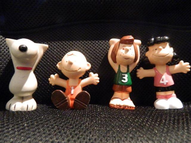Vintage Peanuts gang sports figurines; stackable; set of 4; each is 3