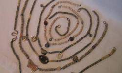 Heishi (also spelled heishe) disk necklaces, set of 6 strands ranging in size from 18 to 24" long. Grayish and pinkish hand carved heishi disks with semi precious stones, agate, horn, mother of pearl (abalone) and sterling silver elements intermixed. May