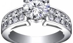 A round cut diamond is set in an 14 kt white gold prong setting. The white metal enhances the quality of an already brilliant diamond.