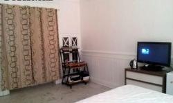 Enjoy this large room with private bathroom in a Lime Stone house on a tree-lined residential block.The room is furnished with a Queen size bed, dresser, mini fridge, flat-screen TV and cable.Ideal for a student, professional or someone relocating to