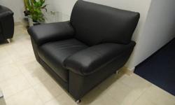 187 Series Black Leather Club Chair and Loveseat. Great condition. Steel silver legs. Originally $2,110.00. Offered at $1,150.00