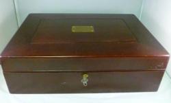 Up for sale an early 20th century mahogany and brass flatware chest with fitted velvet interior made by Reed & Barton. The chest was a presentation gift. The brass plaque on the cover reads, "Presented to Edward L Lyons by Azure Lodge #868 RAM 1913." On