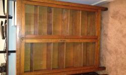 Oak 1940's double glass door bookcase. Used by my uncle for his law books. The piece is in excellent condition; and is a perfect addition to any antique lovers' collection. Purchaser to handle shipping / pick-up arrangements. Bookcase is located on the