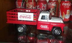 1957 Coca-Cola Chevrolet Flatbed Truck,1/25 scale made by Ertl, fully detailed right down to the dual exhaust and tow hitch. Has a case of coke in the back. Mint condition. Asking $100.00 would make a perfect Christmas gift. 783-2014