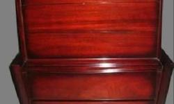 This is an absolutely stunning piece. Must see in person. Clean-lines, mid century modern aesthetic featuring bold, broad-beveled framing. Made by Tri-Bond Furniture in 1958. The mahogany has a deep red color. In excellent condition and extremely well