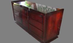 This is an absolutely stunning piece. Must see in person. Clean-lines, mid century modern aesthetic featuring bold, broad-beveled framing. Made by Tri-Bond Furniture in 1958. The mahogany has a deep red color. In really good condition and extremely well