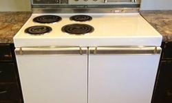 1961 Frigidaire Custom Imperial 40" electric double oven in good condition. Both ovens and 2 of 4 burners work well. Unique vintage oven with a standard large oven on the right side and smaller oven on left with storage drawer beneath. $250 or best offer.