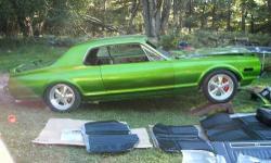 1968 Mercury Cougar pro touring easy project car. 90% complete, new lime green metallic paint job. New 351 Windsor crate engine, new mag wheels, disc brakes, new tires, new black upholstery, needs installation. Has air ride suspension, stainless exhaust,