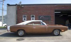 1970 Dodge Charger RT. This car has all original sheet metal, fender tag, and Original Build sheet (copy shown here). The engine is date coded 69 block. This car was a frame On restoration. No expense spared on the paint job. It is the original Dark Tan