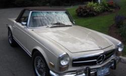 Cream/tan 1971 Mercedes Benz 280 SL in mint condition. Original paint, dashboard, engine. New 5-speed manual transmission, new upholstery and new steering wheel.