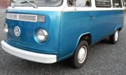 1974 Classic VW transporter - rear seat folds into bed - has ac/heater unit factory on ceiling - upgraded carburetor and new exhaust, good tires, new empi lockout shifter, run and drives excellent - body in fair condition for its age - has need of some