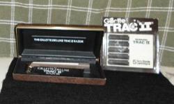 1975 Gillette Deluxe Trac II Safety Razor w Original Box
RICHARDS RAZORS; MAKE ME AN OFFER I CAN'T REFUSE!
This razor and case are in Excellent condition with no signs it was ever used. The razor has
the gold tone metal stripe which in my opinion adds to