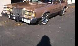 This car has been garage kept since it came out of the show room.The mileage (45,000) is all highway. It is fully loaded and in mint condition.The color is champagne & maroon landau roof. The car also has chrome rims.