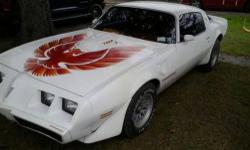 Pontiac trans am white with RED PHOENIX on hood,6.6 t/a engine with 400 trans automatic approximately 70,000 miles snowflake rims car in EXCELLENT CONDITION condition and runs AWESOME,AUTOMATIC DISC BRAKES FRONT & BACK ELECTRIC FUEL PUMP