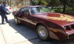 1981 Pontiac Trans Am An American classic currently with 20,300 miles and mechanically sound Maroon exterior with Decals, plus a Buckskin cloth interior Equipped with a V8 automatic transmission Am.Fm in dash radio plus a single disc CD player stereo