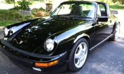 1985 Porsche 911 Carrera Targa, with the most desirable Black on Black combination and loaded with all factory options including leather power seats . This car is very clean! Absolutely rust free and no leaks and everything works . Garaged all it's life..