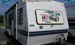 Camp inexpensively but with all the luxuries of home in an older model camper. We just put a new roof on this camper and rear wall. It had some water damage and now it is better than new!! This camper is ready to camp in!! This Damon Hornet has everything
