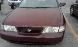 Its 1995 Nissan Sentra. It has over 170,000+ miles. The color is red but has sun damage. The car has its bumps and bruises but drives like no other. Phenomenal acceleration and pretty reliable. It has a leak in the truck and the back bumper needs the