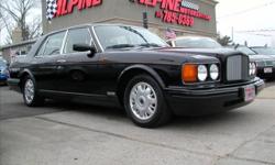 MAGNIFICENT EXAMPLE IN AND OUT!! NEW BENTLEY TRADE!! THIS HEAD TURNER IS FINISHED IN BLACK SAPPHIRE WITH PARCHMENT LEATHER AND SPRUCE PIPING, BURLWOOD TRIMMED INTERIOR WITH ONLY 44K ORIGINAL MILES AND AS CLASSIC AS THEY COME!! 6.75 LITER LOW PRESSURE