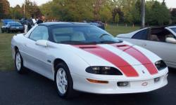 30th anniversary Z28 with only 8 thousand miles on it. Never driven in rain or snow, garage kept, t-tops Cd and cassette, Artic white with hugger orange stripes, white leather interior, 350 LT1 motor with a 4 speed automatic trans. Excellent Condition!