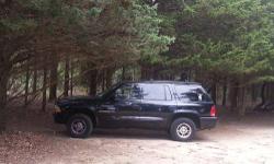 Durango is black with grey cloth interior. Car was just recently serviced with a new computer, new battery, new alternator, new ezhaust as well as power steering hoses. The truck also comes with a trailer hitch and alloy wheels. It is a four door with