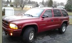 I have an 1998 Dodge Durango SLT. 2x4 & 4x4 H/L (stick shifter on floor)
Red, Grey/black interior.
AUTOMATIC 15mpg around town, 18mpg highway
159,402 miles (driven daily, on the road, so mileage will be going up)
inspection is still good until July of
