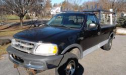 This is a 1998 Ford F-150 XL Long Bed with 4x4 and a 4.2L V6. This is a work truck that features a heavy duty Western plow and utility rack. This is a perfect truck to use for either personal plowing or to make some money for winters to come. Ford trucks