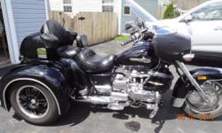 1999 Valkyrie Trike with a CSC Conversion....
40,000 miles...1520cc...six (6) cylinder...4 stroke...shaft drive....liquid cooled, 5 speed
Cruise control, Ultimate Seat, fog lamps, fairing bra, chrome trailer hitch, heel-toe shift, Lots of chrome extras !