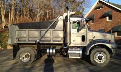 This truck is ready to go. Will pass inspection with flying colors, aluminum cab, 8LL transmission, 3126B Caterpillar motor with 330 HP, 322500 miles. 35000 GVW, 10 dump body with three coal chutes air gate and power tarp. Truck has rear air suspension,