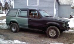 2000 Explorer with 1997 Limited body. Yes only 3900 miles. Evergreen Frost Metallic with tan leather interior. V6 Auto. Bought as a project, in the process of repainting. Many new parts, new NAPA battery, new transponder keys, runs and sounds like new.