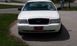 2001 Ford Crown Victoria Interceptor white from the NY Fire Department fleet. This full sized sedan runs and drives excellent. It has a very powerful 8 cylinder, 4.6 liter engine with an automatic transmission, light blue cloth interior, power brakes,