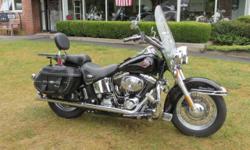 A REALLY CLEAN AND GREAT RUNNING HERITAGE. LOADED!
This bike has seen nothing but the best of care, and it shows. The previous owner also bolted up a few extras. You have a set of engine guard mounted auxilary fog lights. The front lights have chrome