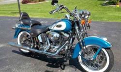 2001 Harley Davidson in Excellent Condition Great shape with only 25,482 miles and plenty of chrome with its eye catching Teal Blue and Peal White finish The Heritage Springer was introduced in 1997 and ended production in 2003 which has placed these