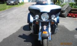 2001 Blue and Silver Harley Davidson with a DFT Trike kit (cost of trike kit installed was $14,000.00) added. Excellent condition with a few blemishes. Lots of extra chrome. Due to the size of the pictures, I could only load three. If you want to see more