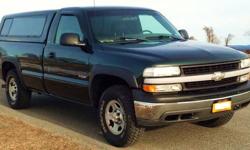 2002 CHEVY Silverado 1500, 4x4, AT, 5.3 Vortec V8, 8' bed with "Cab Hi 2000" color matching fiberglass cap, 81k mi., dark green, gray cloth interior, chrome bumpers, gently used, original paint, no dents, scrapes or rust, new Interstate battery. Excellent