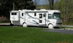 36' National Dolphin Motorhome, 2 slides, on board generator, hardwood floors and ceramic tile. Corian counter tops, 3 burner range top with convection/microwave oven, full size side by side refrigerator/freezer runs on electric or propane. Couch converts