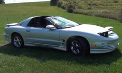 2002 pontiac firebird T-Tops excellent condition only 72,579 original miles , garage kept, well maintained, no rust, Automatic w/ push button Traction control, has extras added on which includes tinted windows , ground effects, blue lights inside and out,