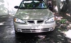 2002 Pontiac grand am se1 95000 miles v6 4dr auto runs good tan with cloth tan ac heat call ed 631 714 9880